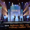 Nghi thức khai trương hệ thống công nghệ thông tin mới của thị trường chứng khoán Việt Nam. (Ảnh: Hứa Chung/TTXVN)