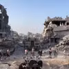 Những tòa nhà bị phá hủy sau các cuộc không kích của Israel xuống Dải Gaza. (Ảnh: IRNA/TTXVN)