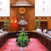 Thủ tướng Phạm Minh Chính chủ trì cuộc họp về tình hình triển khai tuyến đường sắt trọng điểm. (Ảnh: Dương Giang/TTXVN)