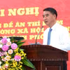 Phó Chủ tịch Ủy ban Nhân dân thành phố Hà Nội Nguyễn Xuân Lưu trình bày tóm tắt Đề án thí điểm mô hình “xã, phường xã hội chủ nghĩa” trên địa bàn thành phố Hà Nội. (Ảnh: Trung Nguyên/TTXVN)