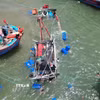 Hiện trường vụ tàu cá NA-90751-TS của ngư dân xã Diễn Châu (tỉnh Nghệ An) bị chìm tại vị trí cách cửa biển Lạch Vạn khoảng 1km. (Ảnh: Xuân Tiến/TTXVN)