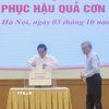 Thủ tướng Phạm Minh Chính và các Phó Thủ tướng quyên góp, ủng hộ đồng bào khắc phục hậu quả bão số 10. (Ảnh: Dương Giang/TTXVN)
