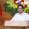 Thủ tướng Phạm Minh Chính chủ trì họp triển khai giải pháp khắc phục hậu quả bão số 10. (Ảnh: Dương Giang/TTXVN)