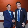 Thủ tướng Phạm Minh Chính gặp Thủ tướng Singapore Lawrence Wong. (Ảnh: Dương Giang/TTXVN)