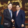Thủ tướng Phạm Minh Chính và ông Hayashi Yoshimasa, Bộ trưởng Nội vụ và Truyền thông Nhật Bản. (Ảnh: Dương Giang/TTXVN)