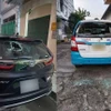 Nhiều ôtô bị Long đập vỡ kính. (Nguồn: Báo Lâm Đồng)