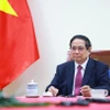 Thủ tướng Phạm Minh Chính điện đàm với Thủ tướng New Zealand Christopher Luxon. (Ảnh: Dương Giang/TTXVN)