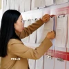 Cán bộ xã ở Quảng Trị niêm yết danh sách cử tri bầu cử đại biểu Quốc hội khóa XVI và đại biểu HĐND các cấp nhiệm kỳ 2026-2031. (Ảnh: Tá Chuyên/TTXVN)