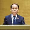Bộ trưởng Tư pháp Hoàng Thanh Tùng, thừa ủy quyền của Thủ tướng Chính phủ trình bày Tờ trình về 04 dự án: Luật Hộ tịch (sửa đổi); Luật sửa đổi, bổ sung một số điều của Luật Công chứng; Luật sửa đổi, bổ sung một số điều của Luật Trợ giúp pháp lý; Luật Tiếp cận thông tin (sửa đổi). (Ảnh: Doãn Tấn/TTXVN)