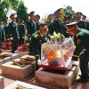 An táng 26 hài cốt liệt sỹ hy sinh tại Lào và Campuchia. (Ảnh: Khoa Chương/TTXVN)
