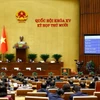 Quốc hội biểu quyết thông qua Luật Dẫn độ. (Ảnh: Doãn Tấn/TTXVN)