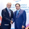 Thủ tướng Phạm Minh Chính gặp Thủ tướng Timor-Leste Xanana Gusmao. (Ảnh: Dương Giang/TTXVN)