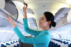 Tiếp viên Nguyễn Thị Thanh Huyền của Hãng hàng không Vietnam Airlines lần đầu đón Tết xa nhà. (Ảnh: PV/Vietnam+)