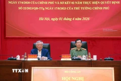 Phó Thủ tướng Thường trực Nguyễn Hòa Bình và Thượng tướng Lê Văn Tuyến, Thứ trưởng Bộ Công an chủ trì hội nghị. (Ảnh: Phạm Kiên/TTXVN)
