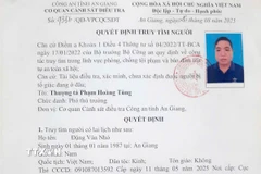 Quyết định của Cơ quan Cảnh sát điều tra Công an tỉnh An Giang truy tìm Đặng Văn Nhỏ. (Nguồn: TTXVN phát)