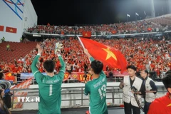 Các cầu thủ U22 Việt Nam hân hoan trong niềm vui chiến thắng. (Ảnh: Minh Quyết/TTXVN)