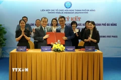 Quang cảnh lễ ký kết. (Ảnh: Quốc Dũng/TTXVN)