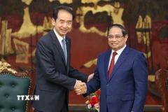Thủ tướng Phạm Minh Chính tiếp Đại sứ Trung Quốc tại Việt Nam Hà Vĩ. (Ảnh: Dương Giang/TTXVN)
