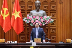 Thủ tướng Phạm Minh Chính chủ trì cuộc họp Thường trực Chính phủ về bình ổn giá xăng dầu. (Ảnh: Dương Giang/TTXVN)