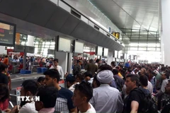 Hành khách tại sân bay quốc tế Indira Gandhi ở New Delhi, Ấn Độ. (Ảnh: ANI/TTXVN)