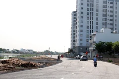Đoạn đường ven kênh được thông xe kỹ thuật rên địa bàn quận Gò Vấp. (Ảnh: Tiến Lực/TTXVN)