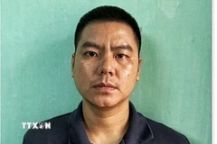 Đối tượng Lê Hữu Tuấn tại cơ quan điều tra. (Nguồn: TTXVN phát)