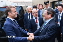 Thủ tướng Phạm Minh Chính hội kiến Tổng thống Pháp Emmanuel Macron. (Ảnh: Dương Giang/TTXVN)