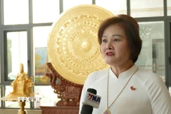 Bà Phạm Thị Minh Hường, Chủ tịch Hội đồng quản trị kiêm Tổng Giám đốc Công ty Gold Phuc, Ủy viên Ban Thường vụ Tổng hội người Việt Nam tại Lào, Phó Chủ tịch Hiệp hội Doanh nhân Việt Nam ở nước ngoài, bày tỏ niềm tin vào những thành tựu mà Việt Nam đã đạt được trong nhiệm kỳ vừa qua. (Ảnh: Xuân Tú/TTXVN)