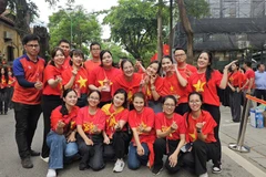 Đoàn viên đại diện cho tuổi trẻ TTXVN tham gia Khối Báo chí Cách mạng Việt Nam trong lễ diễu hành kỷ niệm 80 năm Quốc khánh 2/9. (Nguồn: Vietnam+)