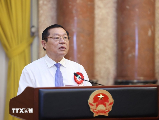 Đồng chí Lại Xuân Môn, Uỷ viên Trung ương Đảng, Phó Trưởng ban Thường trực Ban Tuyên giáo và Dân vận Trung ương báo cáo. (Ảnh: Lâm Khánh/TTXVN) ttxvn-chu-tich-nuoc-luong-cuong-gap-mat-cac-nha-bao-tieu-bieu-toan-quoc-8102669-6.jpg