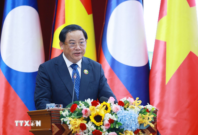 ttxvn-thu-tuong-va-thu-tuong-lao-tham-du-tri-hoi-nghi-xuc-tien-dau-tu-viet-nam-lao-nam-2025-8448785-3.jpg
