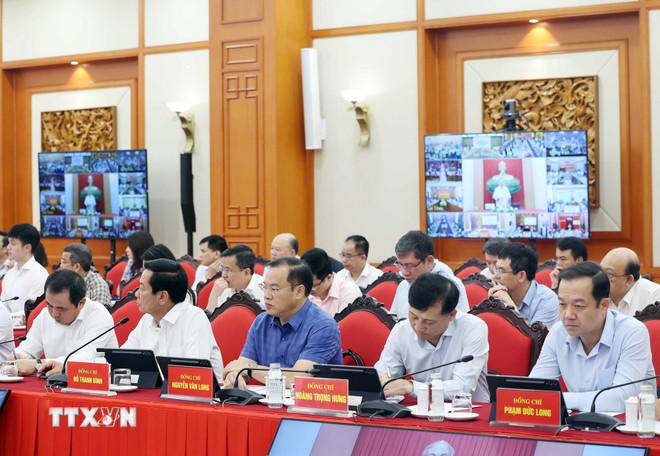 Delegados asistentes a la reunión. (Foto: Thong Nhat/VNA) ttxvn-tong-bi-thu-to-lam-chu-tri-phien-hop-cua-thuong-truc-ban-chi-dao-trung-uong-ve-phat-trien-khoa-hoc-cong-nghe-doi-moi-sang-tao-va-chuyen-doi-8339979-1.jpg