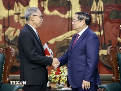 Thủ tướng Phạm Minh Chính tiếp ông Adam Mulawarman Tugio, Đại sứ Đặc mệnh toàn quyền Cộng hòa Indonesia tại Việt Nam. (Ảnh: Dương Giang/TTXVN)