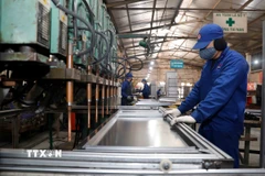 Hoạt động tại xưởng đột dập của Công ty Cổ phần Xuân Hòa, tỉnh Phú Thọ. (Ảnh: Trần Việt/TTXVN)