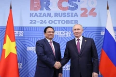 Trong khuôn khổ Hội nghị các Nhà lãnh đạo Nhóm các nền kinh tế mới nổi (BRICS) mở rộng tại Kazan, Liên bang Nga, tối 24/10/2024, Thủ tướng Phạm Minh Chính gặp Tổng thống Liên bang Nga Vladimir Putin, Chủ tịch Nhóm BRICS năm 2024. (Ảnh: Dương Giang/TTXVN)