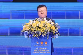 Ông Lê Quốc Minh, Ủy viên Trung ương Đảng, Chủ tịch Hội Nhà báo Việt Nam, Tổng biên tập Báo Nhân dân phát biểu khai mạc. (Ảnh: Hoài Nam/Vietnam+)