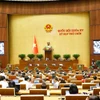 Quốc hội tiếp tục thảo luận về kết quả phát triển kinh tế-xã hội. (Ảnh: TTXVN)