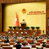 Quốc hội thảo luận ở hội trường về dự thảo Nghị quyết của Quốc hội quy định về việc xử lý một số vấn đề liên quan đến sắp xếp tổ chức bộ máy nhà nước. (Ảnh: TTXVN)