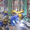 Hoạt động sản xuất tại một cụm công nghiệp trên địa bàn Hà Nội. (Ảnh: TTXVN)