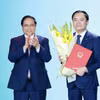 Thủ tướng Phạm Minh Chính trao Quyết định bổ nhiệm ông Lê Ngọc Sơn, Tổng Giám đốc Tập đoàn Công nghiệp-Năng lượng Quốc gia Việt Nam giữ chức Chủ tịch HĐTV của Tập đoàn. (Ảnh: Dương Giang/TTXVN)