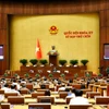Quốc hội thảo luận về việc sắp xếp đơn vị hành chính cấp tỉnh năm 2025. (Ảnh: TTXVN)