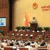 Quốc hội nghe Tờ trình và báo cáo thẩm tra dự thảo Nghị quyết của Quốc hội về phổ cập giáo dục mầm non cho trẻ em mẫu giáo từ 3 đến 5 tuổi. (Ảnh: An Đăng/TTXVN) 