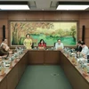 Đoàn đại biểu Quốc hội thành phố Hà Nội thảo luận tại tổ. (Ảnh: An Đăng/TTXVN)