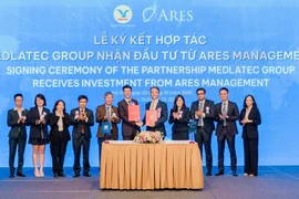 Lễ ký kết hợp tác giữa hai bên. (Ảnh: PV/Vietnam+)