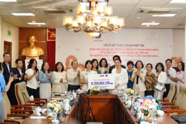 Cục Bà mẹ và Trẻ em ký kết Thỏa thuận hợp tác với đối tác. (Ảnh: PV/Vietnam+)