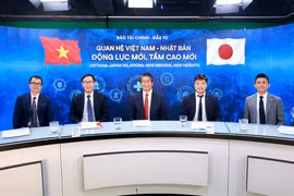 Các đại biểu trao đổi tại Tọa đàm. (Ảnh: PV/Vietnam+)