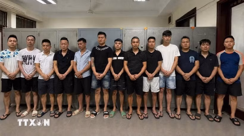 Các đối tượng tượng bị bắt. (Ảnh: TTXVN phát)