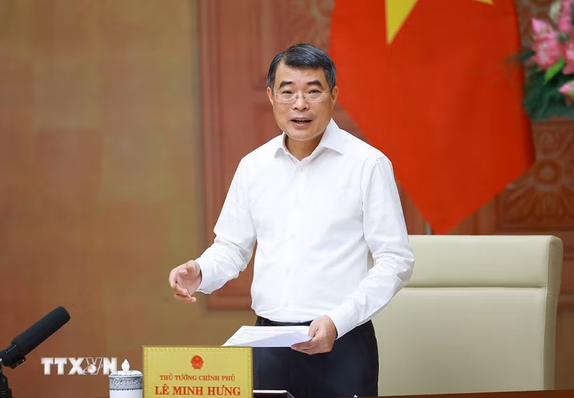 Thủ tướng Lê Minh Hưng làm việc với lãnh đạo Bộ Xây dựng. (Ảnh: Dương Giang/TTXVN)