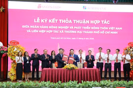 Lễ ký kết thỏa thuận hợp tác giữa Agribank và Saigon Co.op. (Ảnh: Vietnam+)