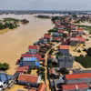 Mưa lũ sau bão số 11 gây thiệt hại trên 8.720 tỷ đồng, còn hơn 12.230 nhà bị ngập. (Ảnh: Hoàng Hiếu/TTXVN)